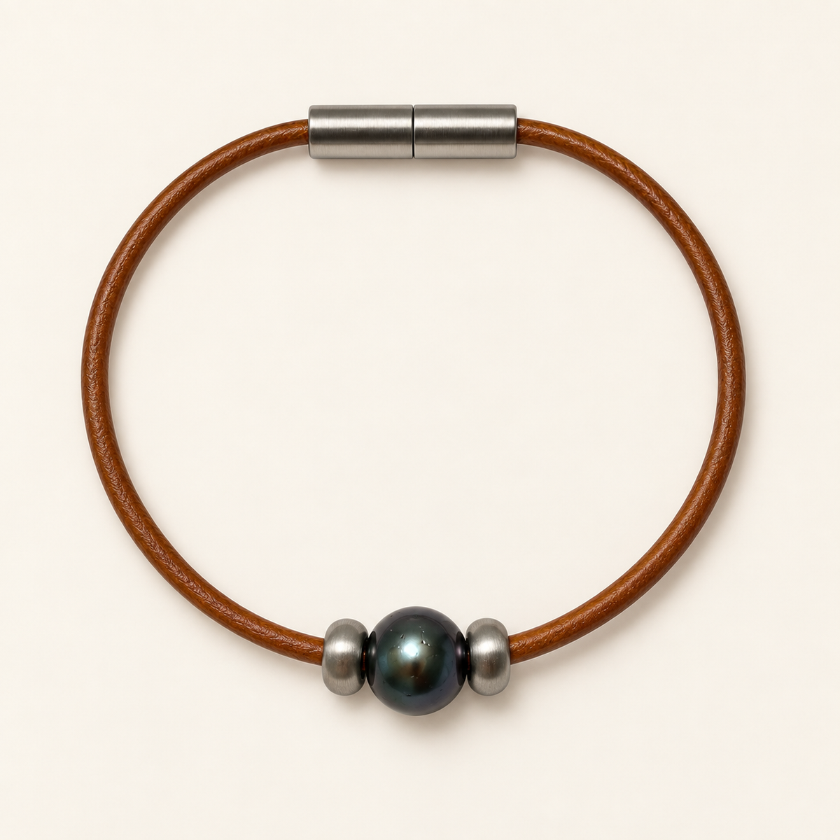 Black pearl and stainless steel on an amber leather bracelet.
