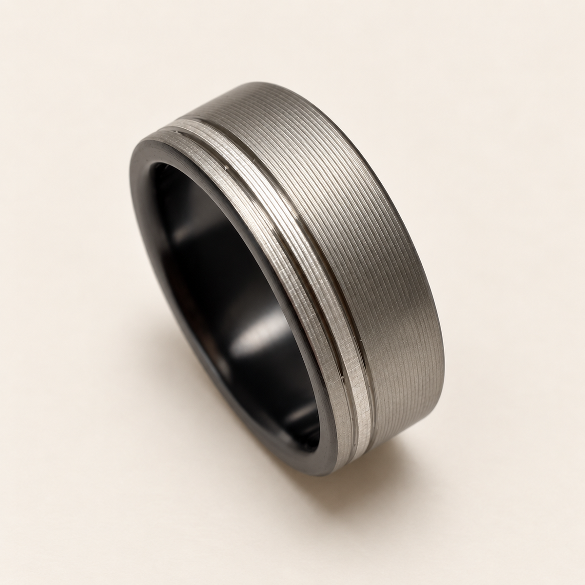 Grooved Spexton ring on a cream background.